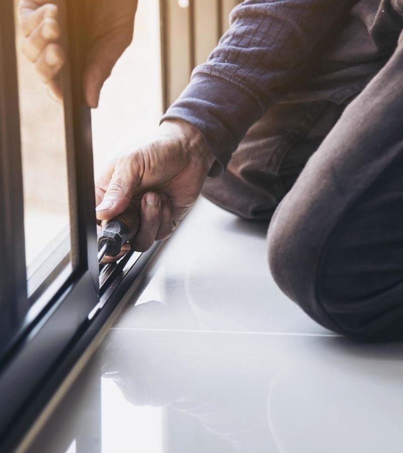 A window featuring a latch, emphasizing the need for regular window track maintenance services.